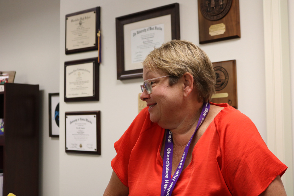 principal side view smiling in her office