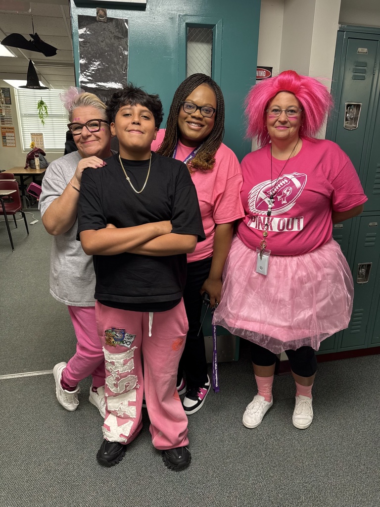 three school members standing by the door with student wearing pink
