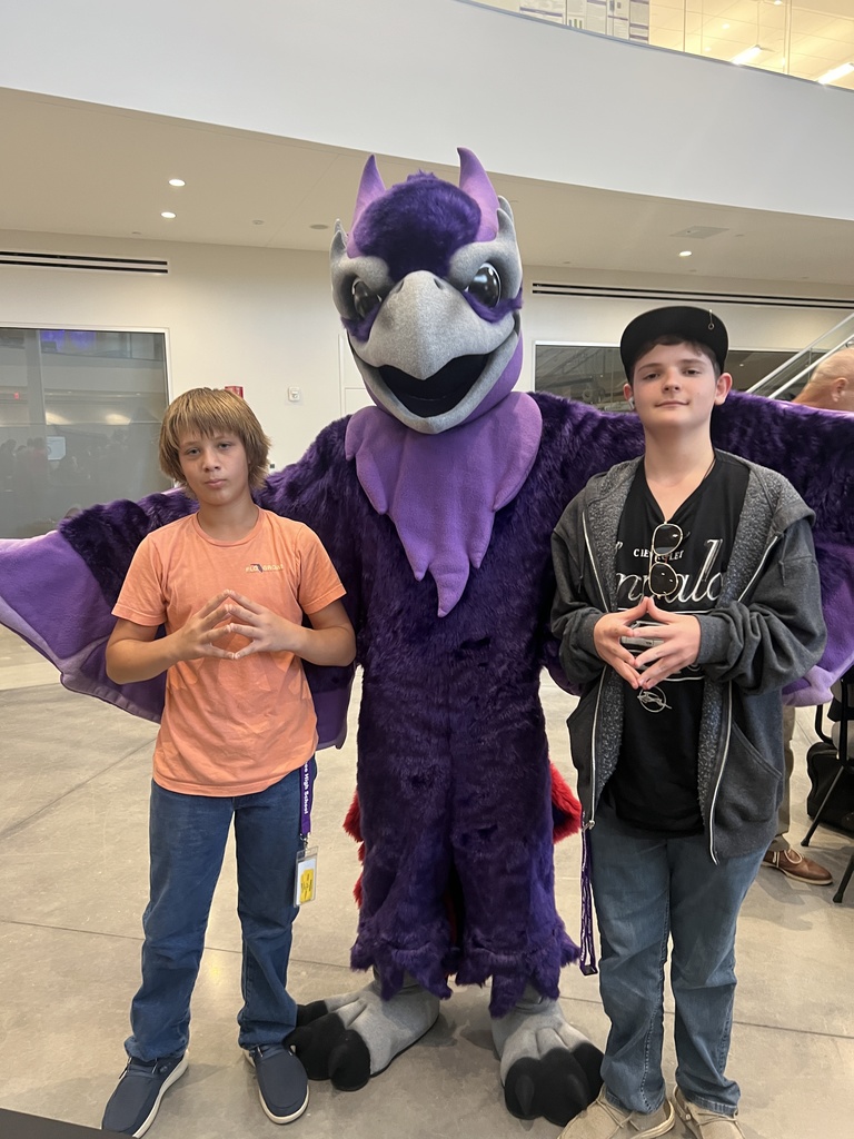 two students with university mascot