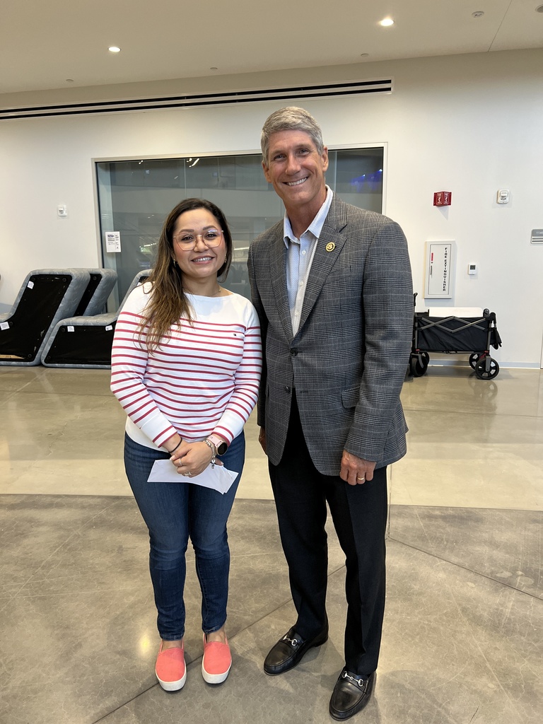 teacher standing with congressman