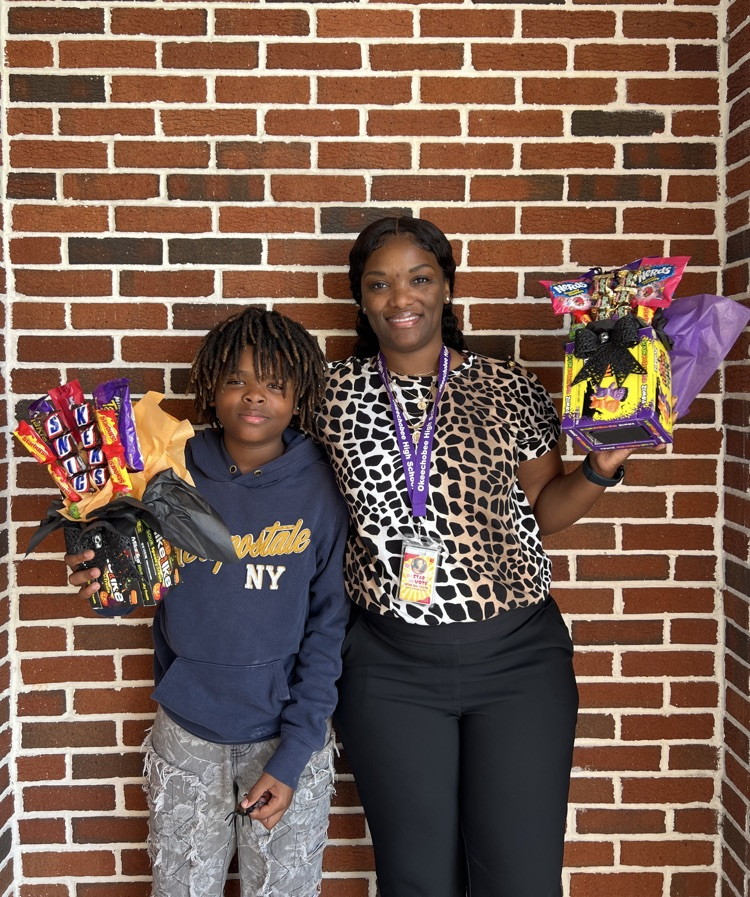 guidance counselor with student holding candy basket