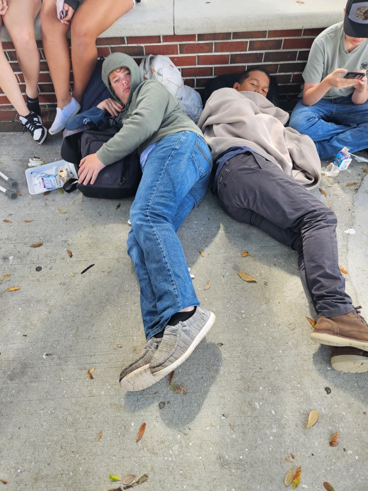 two kids laying down at lunch