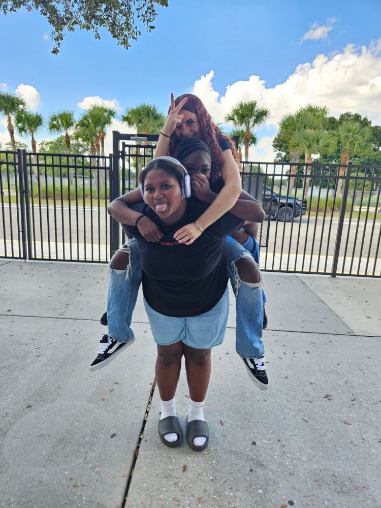 two girls on top of each others back