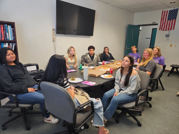 nine students at student of the month luncheon