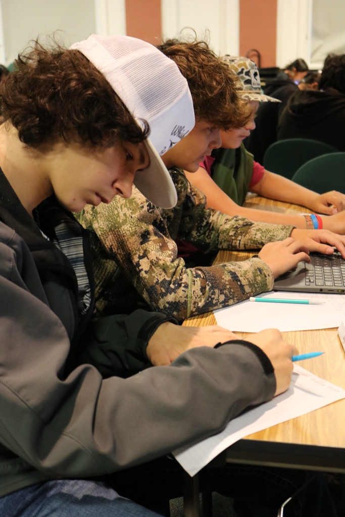 students writing down their grades