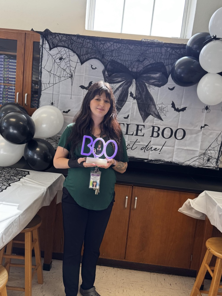 ese clerk at Halloween baby shower