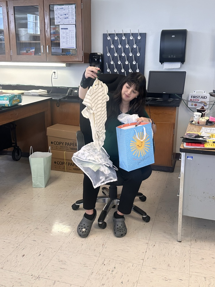 ese clerk opening gifts