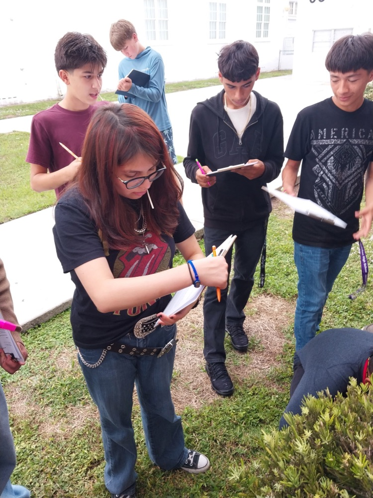 students writing In science worksheets