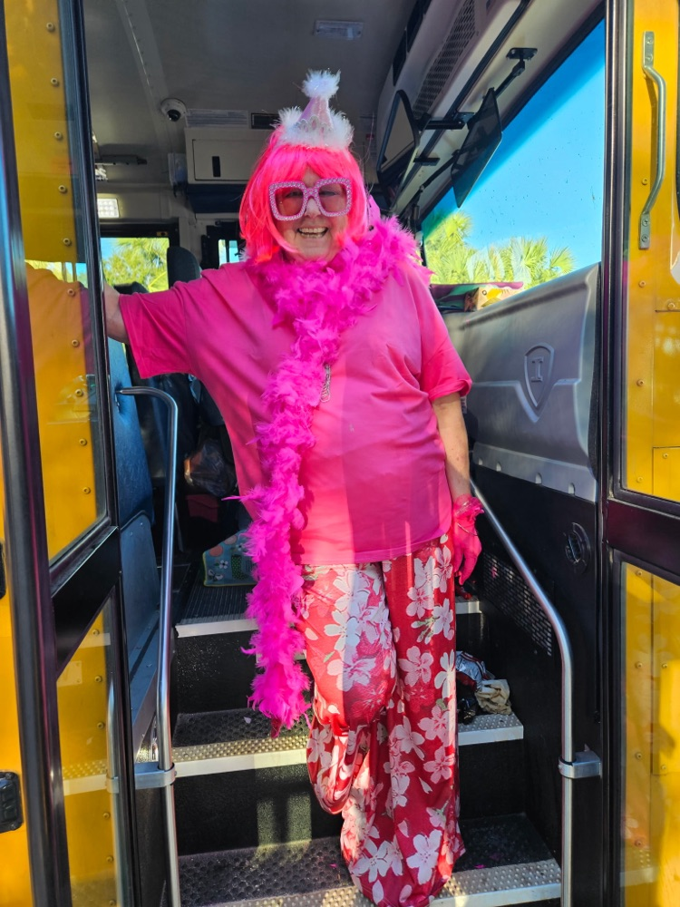 bus driver dressed all in pink for Halloween