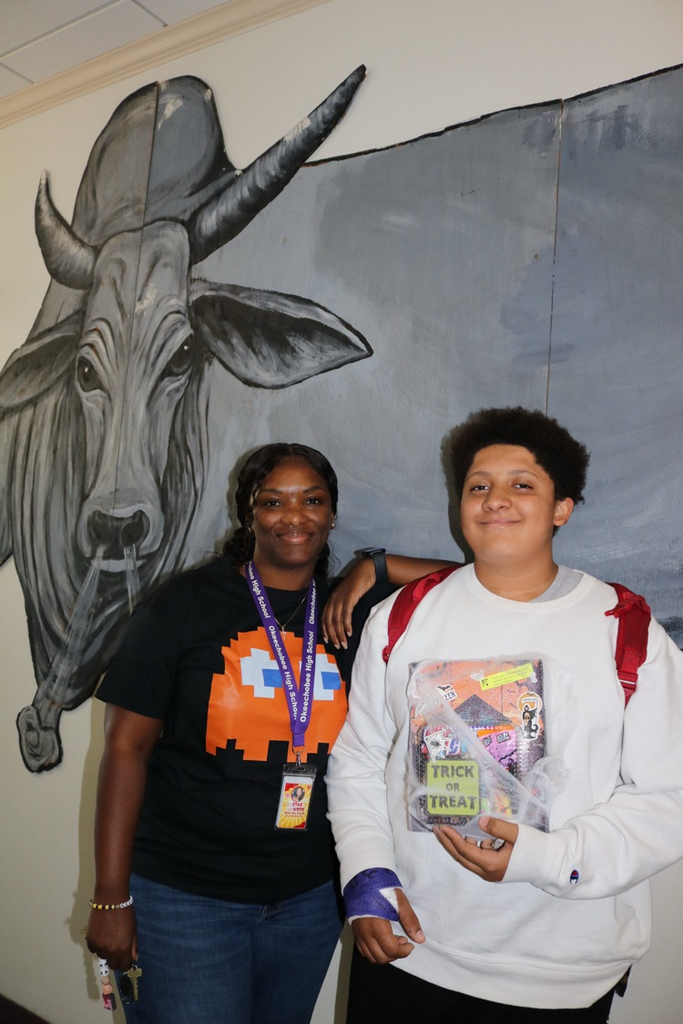 student and guidance counselor showing attendance prize