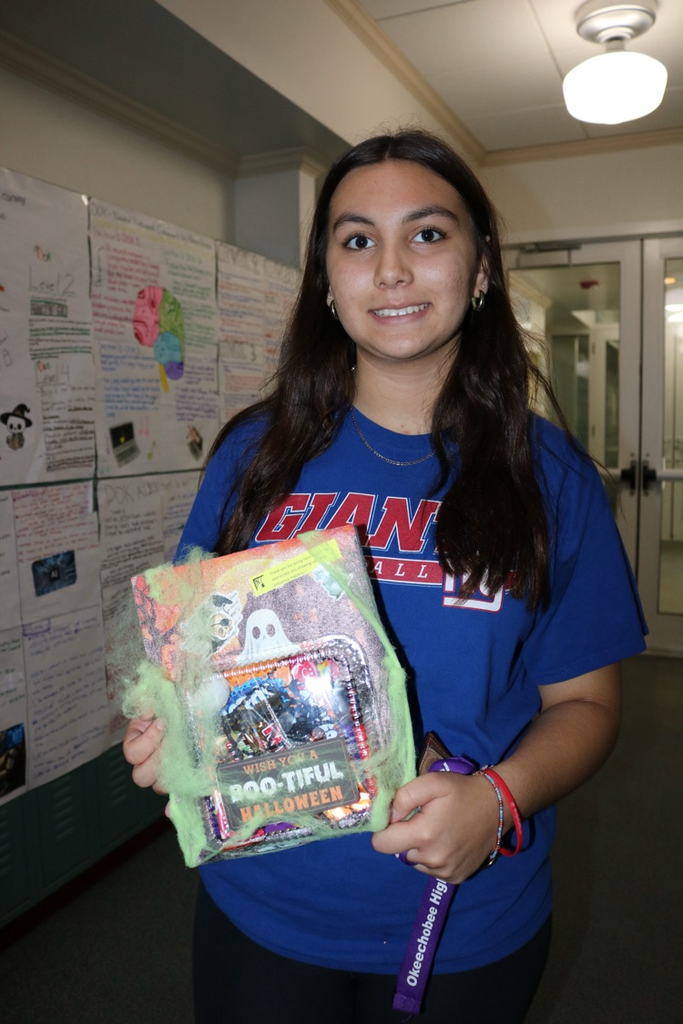 student holding attendance prize