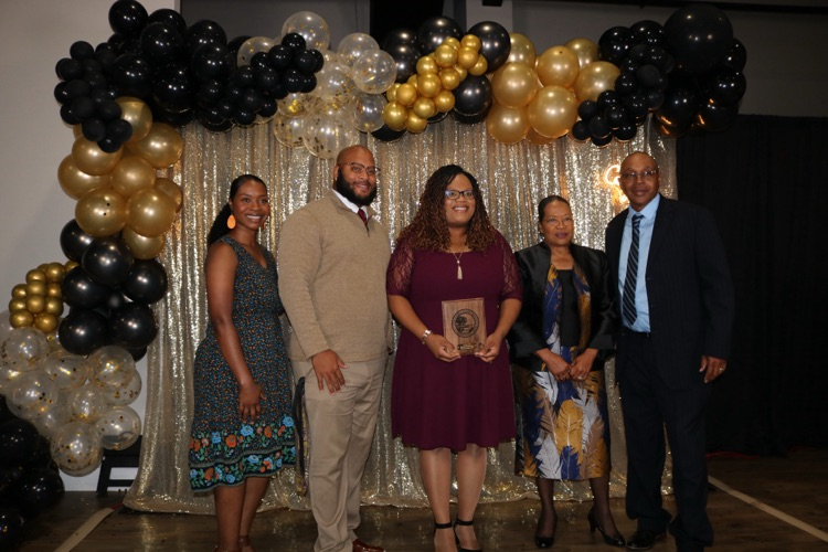 assistant principal with family at banquet