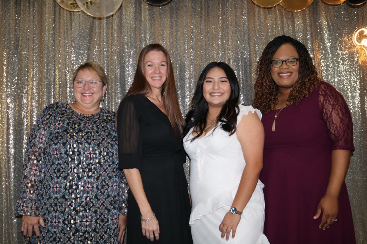four school members dressed fancy