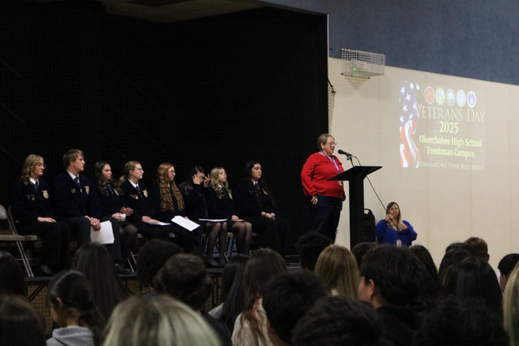 principal speaking in Veterans Day program