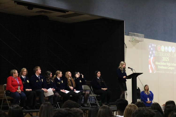 student from ffa speaking on stage for Veterans Day
