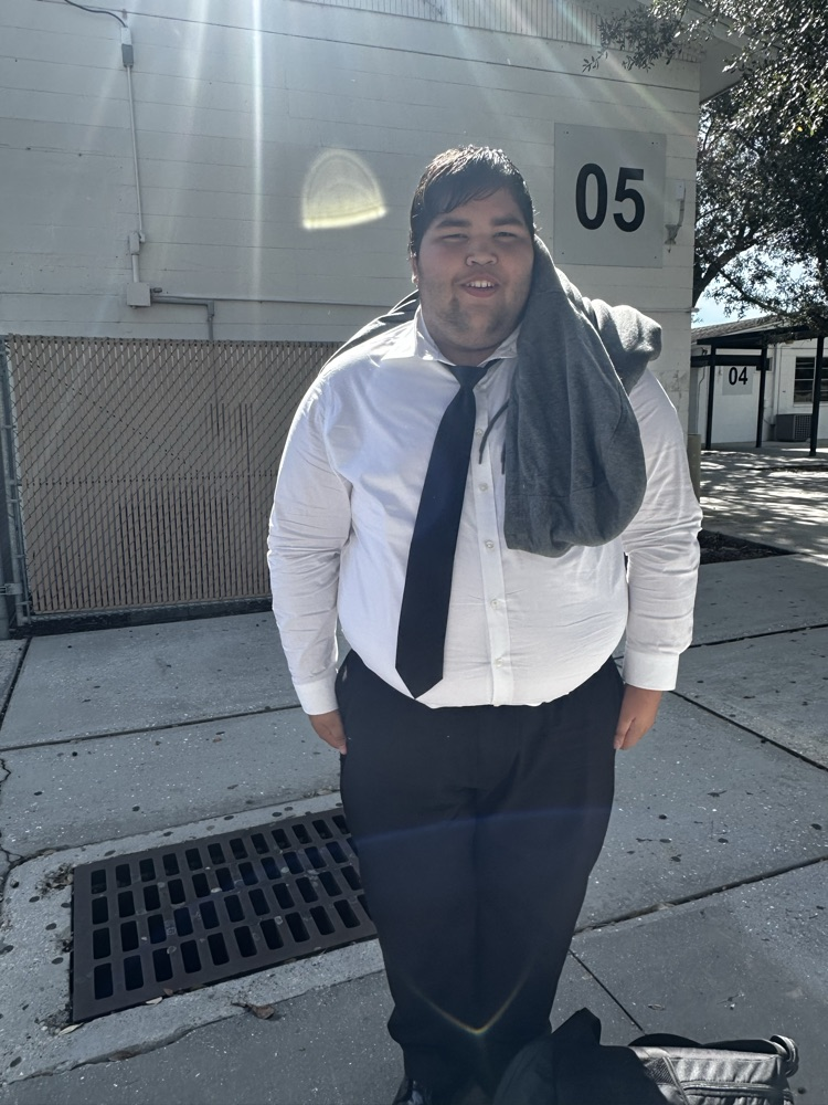 student dressed up in suit