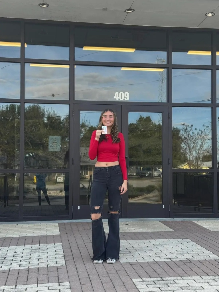 student showing their license