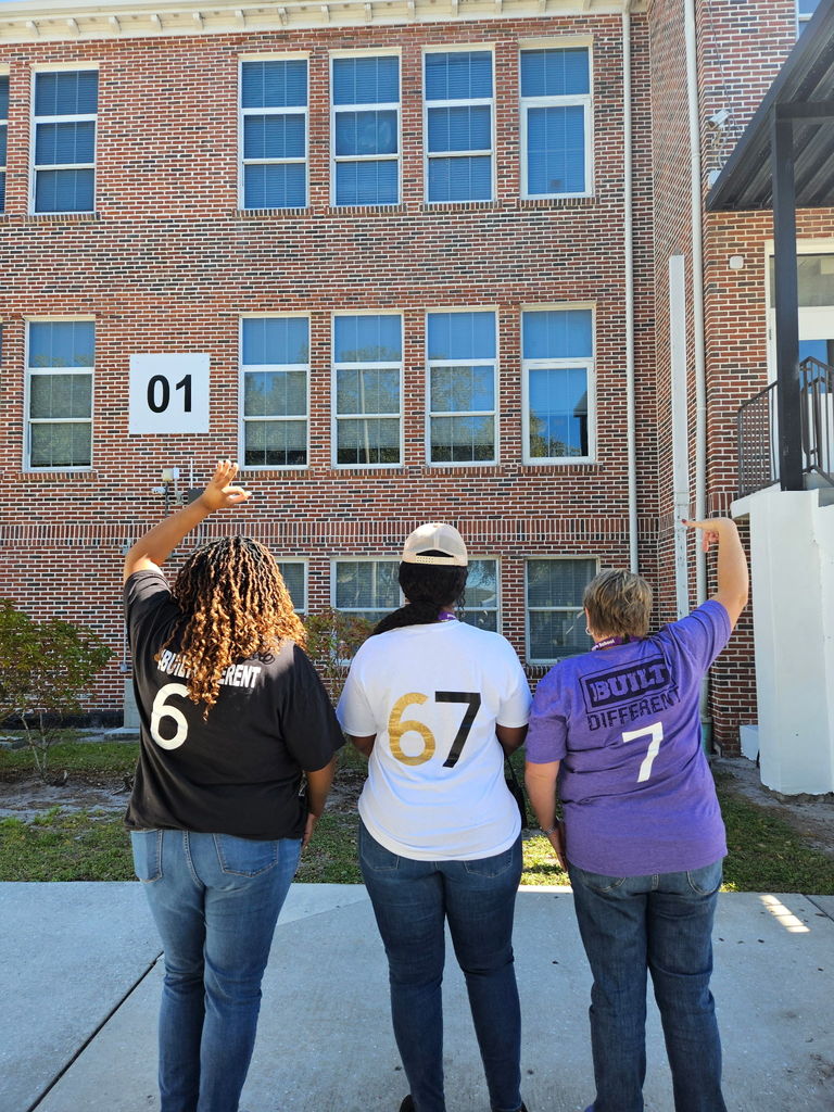 admin wearing 67 gear for 67th day of school