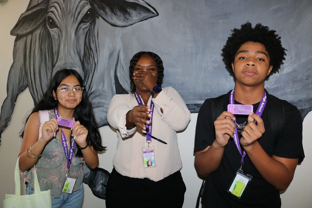 two students with guidance counselor