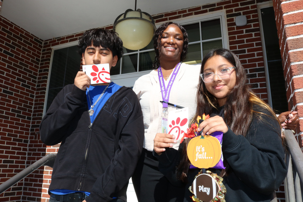 two students with guidance counselor