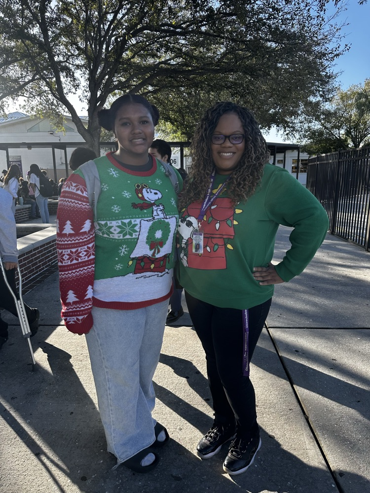 assistant principal and student wearing ugly Christmas sweater 
