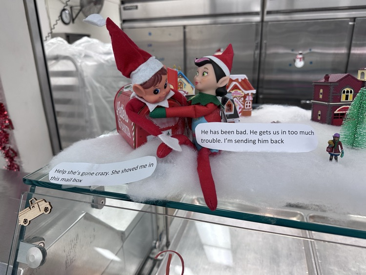 two elves playing in school cafeteria 