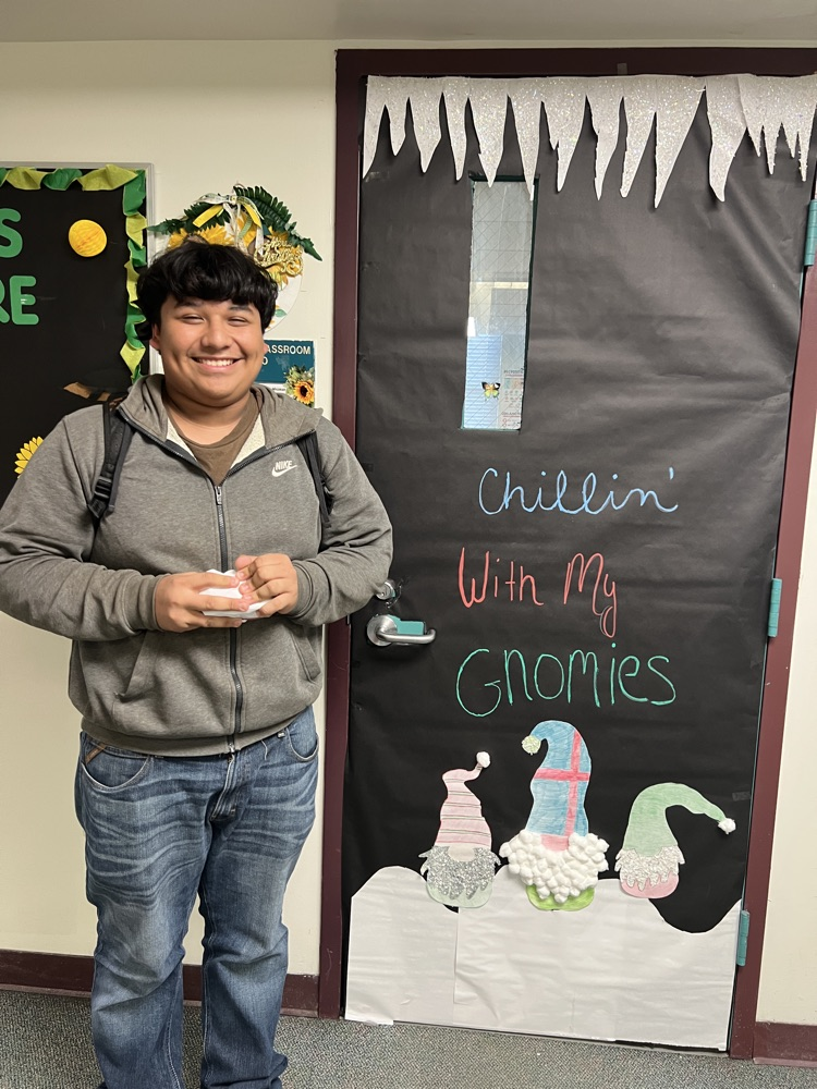 student by decorated door