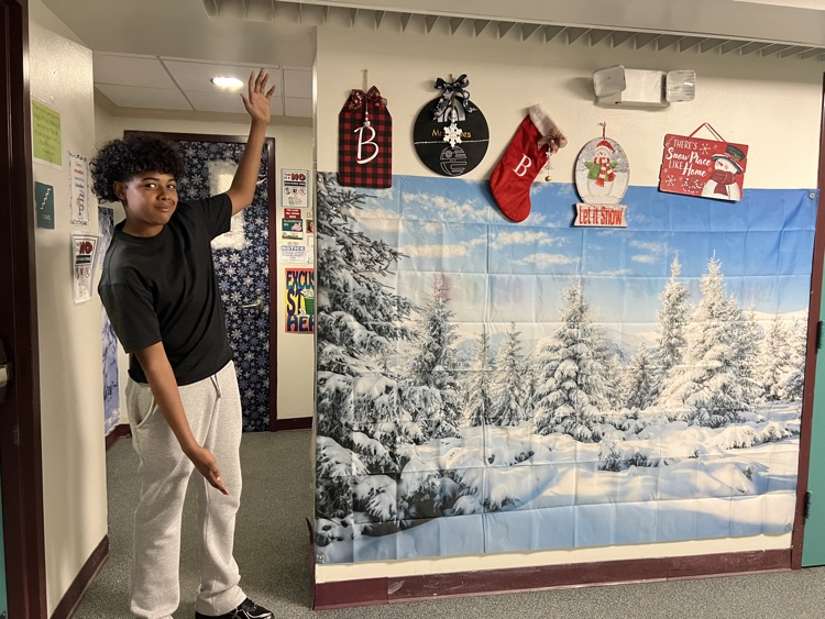 student by decorated door