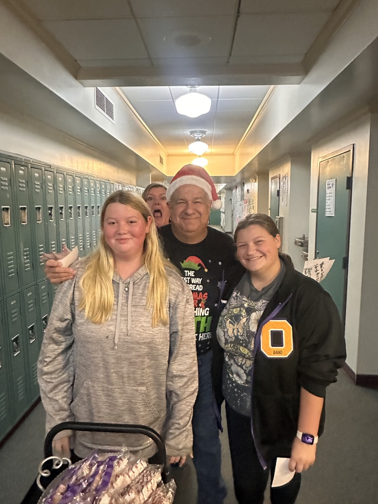 teacher with students in hallway