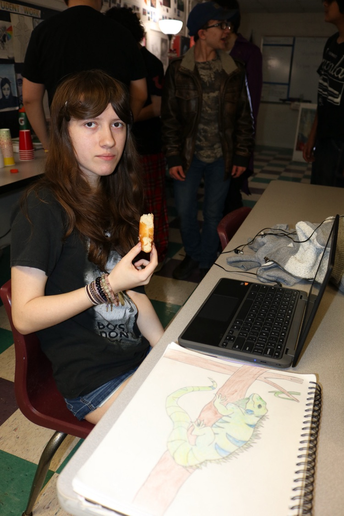 students eating donuts in art class