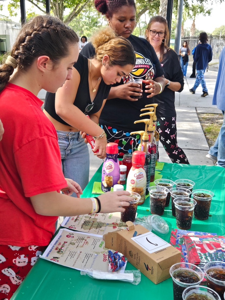 students serving sodas. 