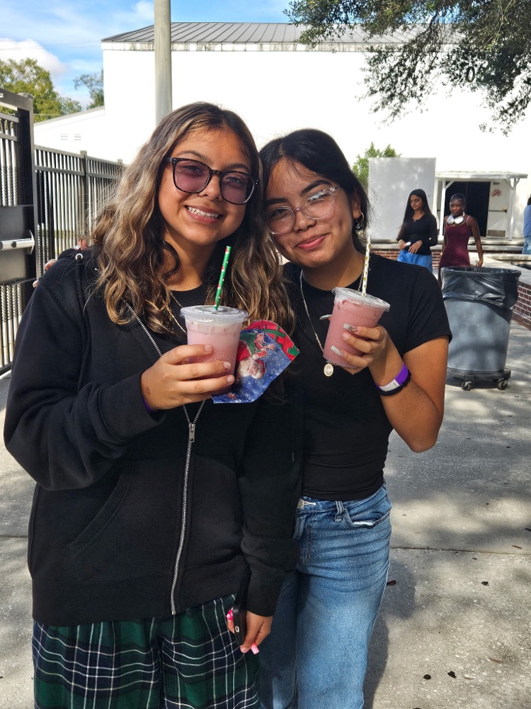 two girls showing drinks