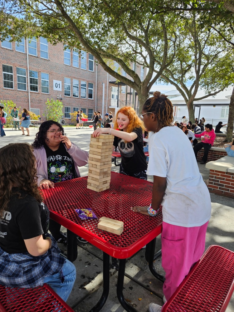students playing games in courtyard