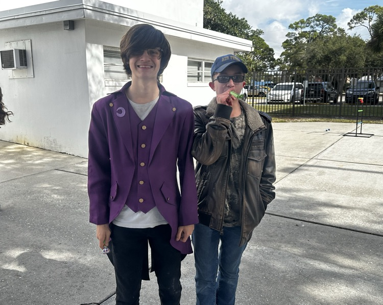 two students smiling in courtyard