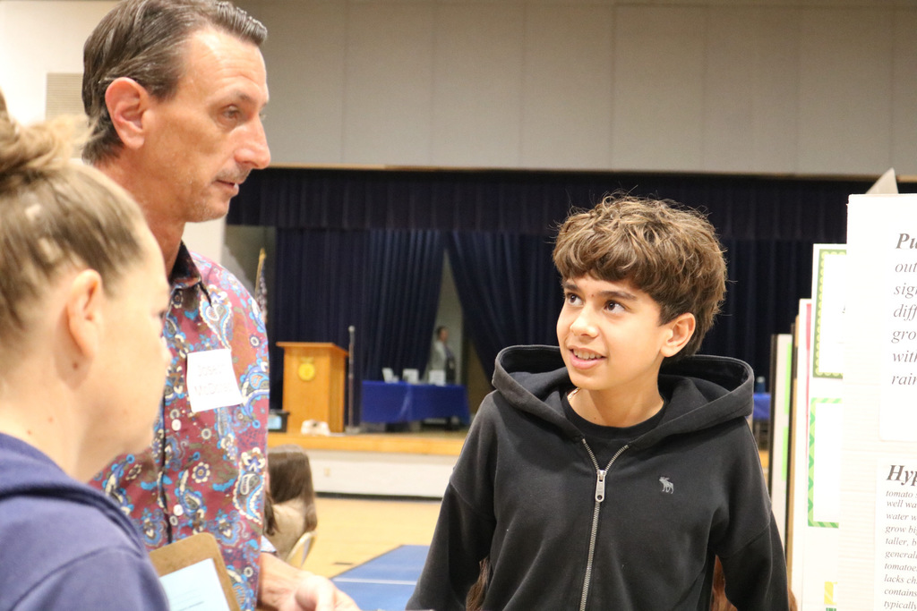 student presenting at science fair