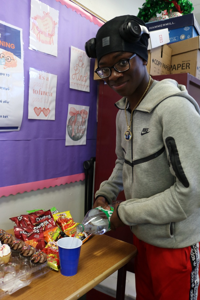 student serving soda and snacks 