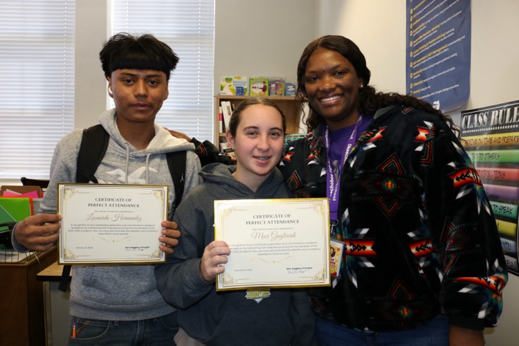 guidance with two students holding certificates 