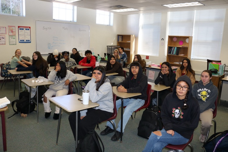group of students celebrating attendance in classroom