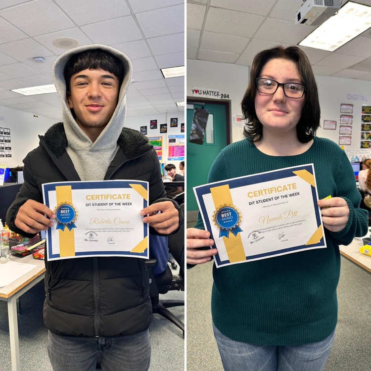 two students holding certificates 