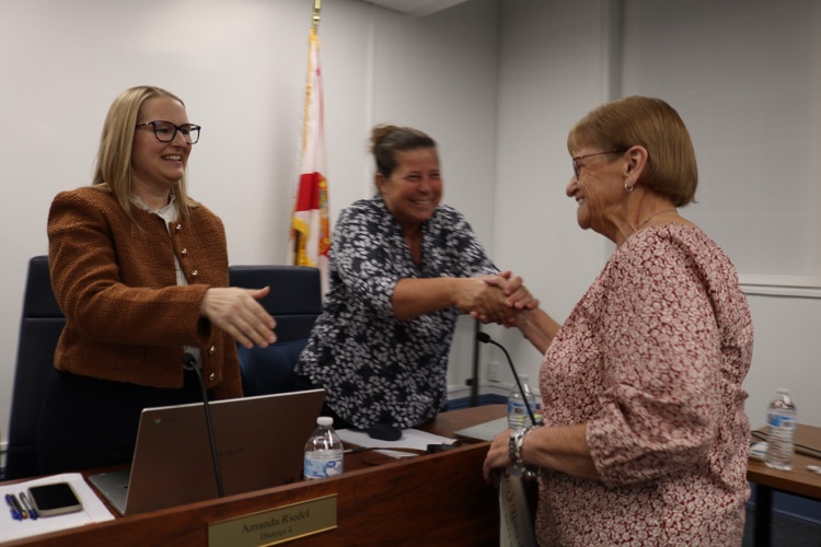 data processor being honored by school board 