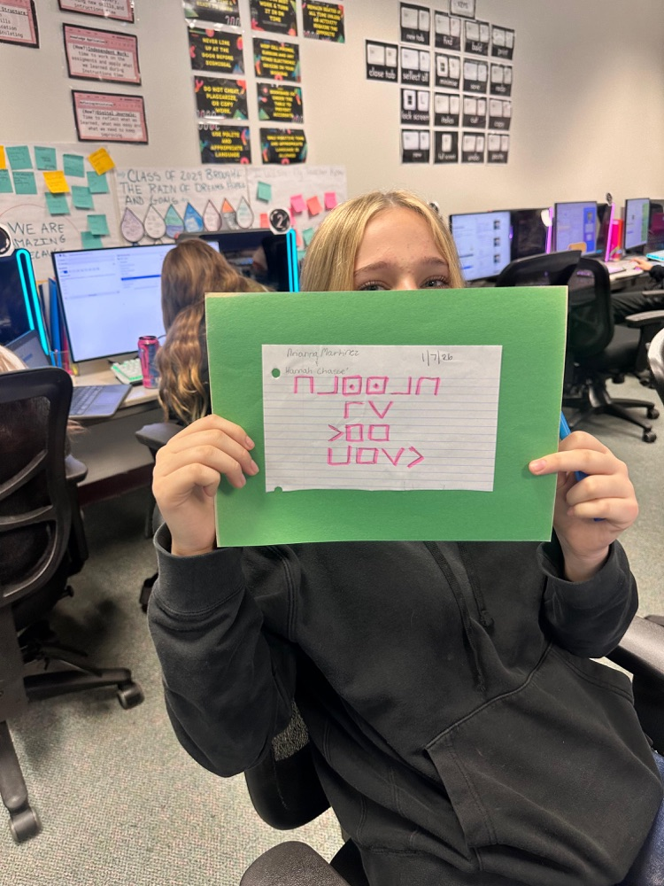 student showing off cipher on paper