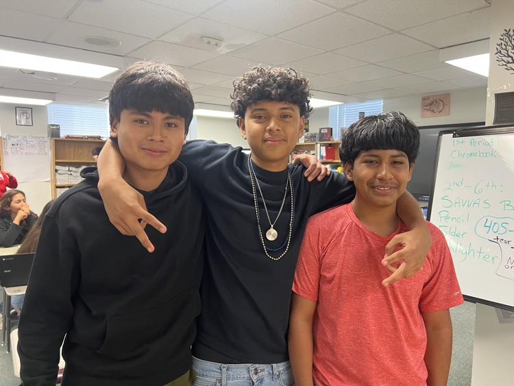 three students in English class