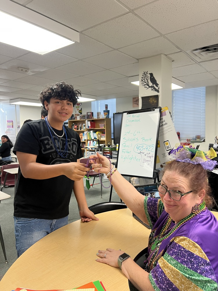 student and teacher playing rock paper scissors