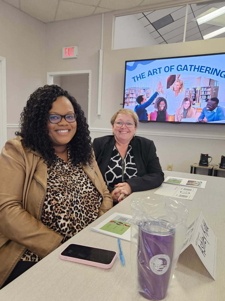 principal and assistant principal sitting at HEC professional development