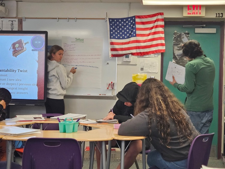 students diving into English text in Class