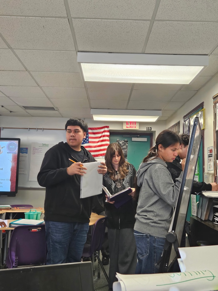 students diving into English text in Class