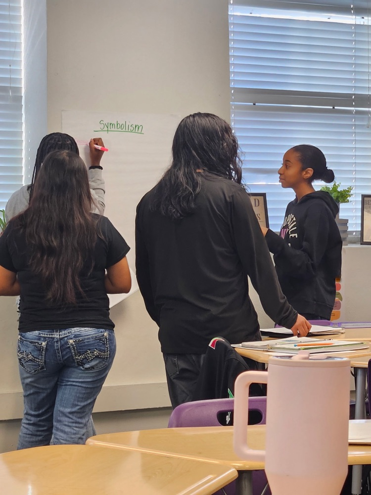 students diving into English text in Class