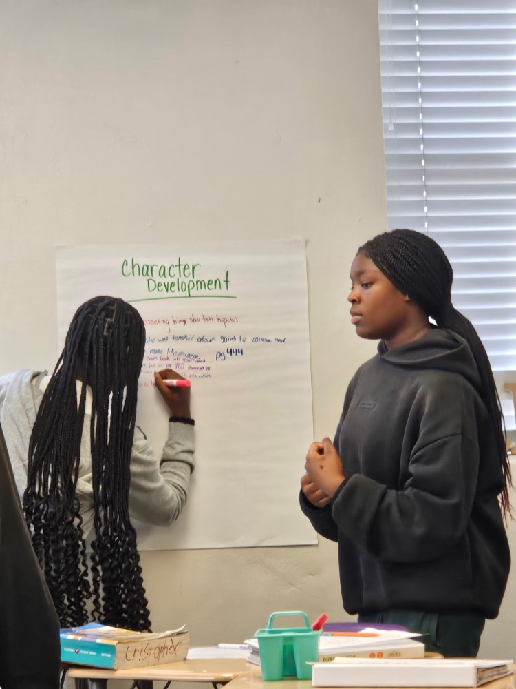 students diving into English text in Class
