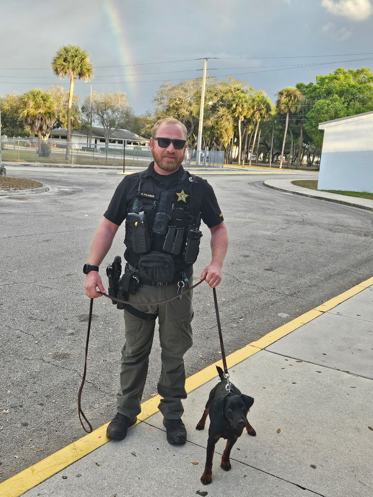 SRO and k9 dog with rainbow