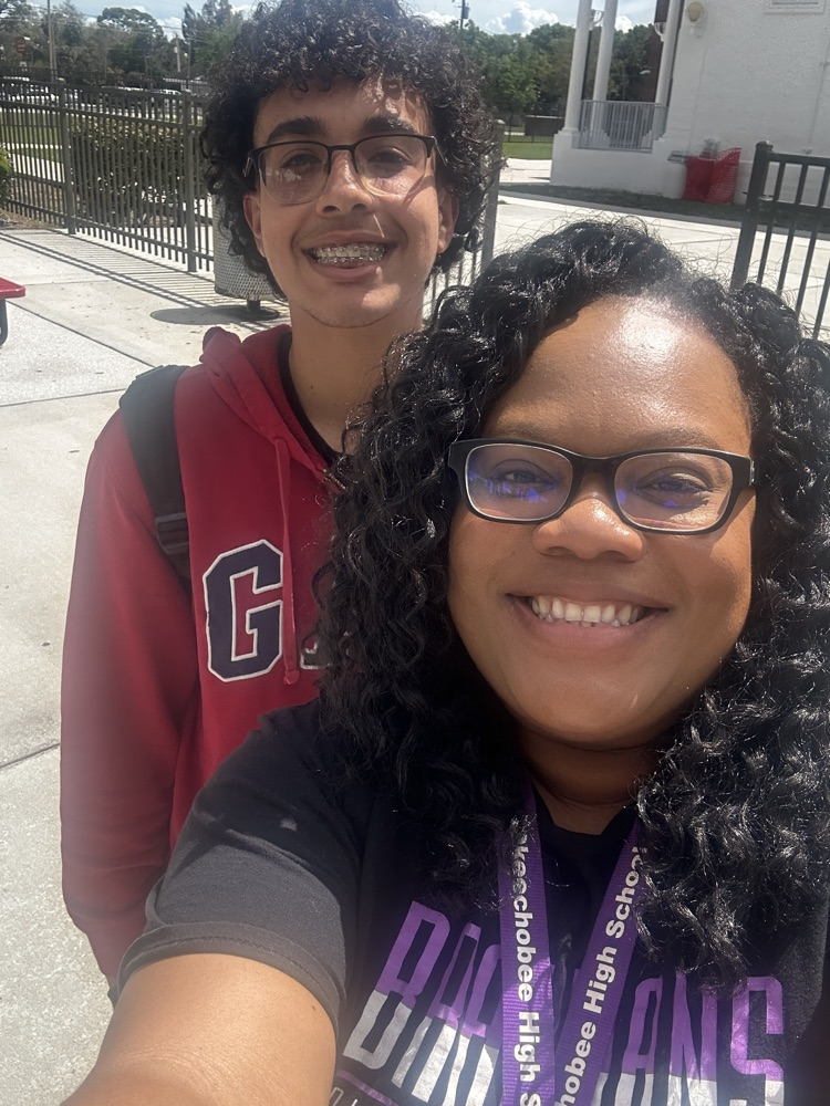 principal and student smiling at selfie